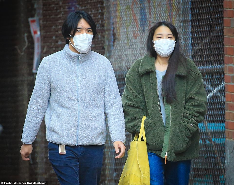 50819301-10343027-Mako_and_her_new_husband_Kei_Komuro_were_spotted_out_in_New_York-a-23_1640374593944.jpg