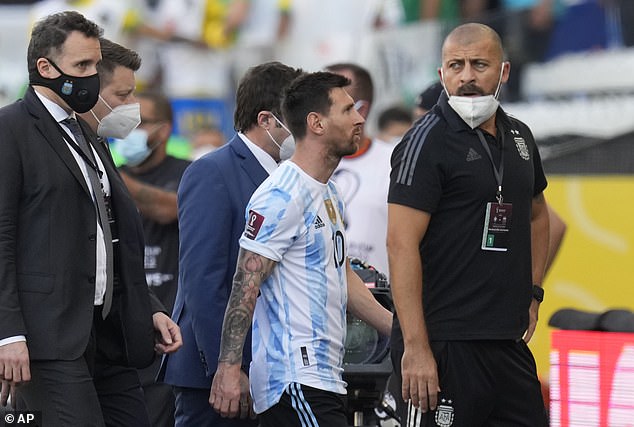 47541045-9960541-Argentina_icon_Lionel_Messi_centre_walks_off_the_pitch_as_author-a-37_1630878094860.jpg