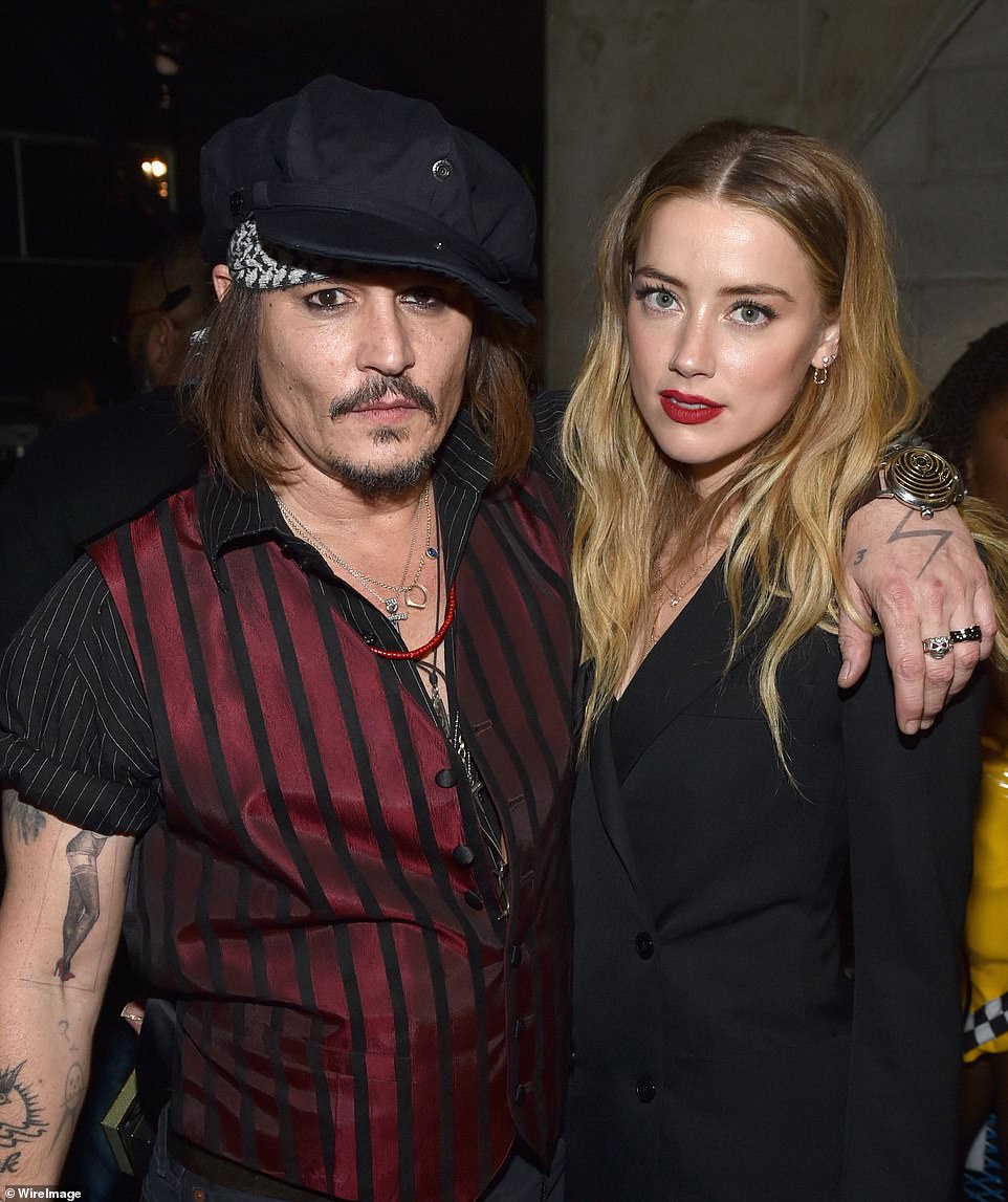 30019136-10707779-Amber_Heard_and_Johnny_Depp_whose_divorce_was_finalized_in_Janua-a-45_1649712749074.jpg