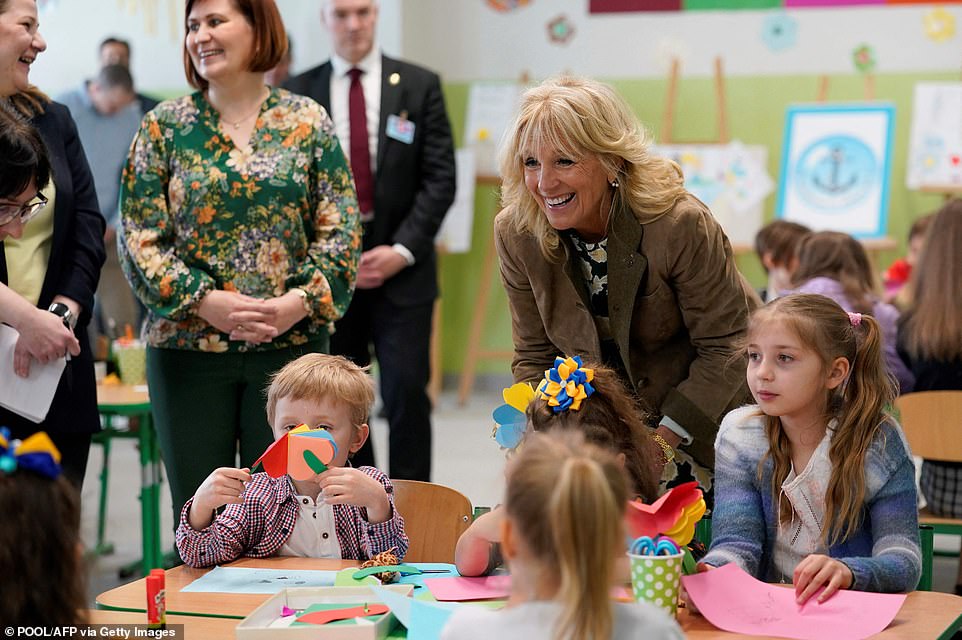 57555471-10794525-Jill_Biden_meets_with_Slovak_and_Ukrainian_mothers_and_their_chi-a-125_1652041196083.jpg