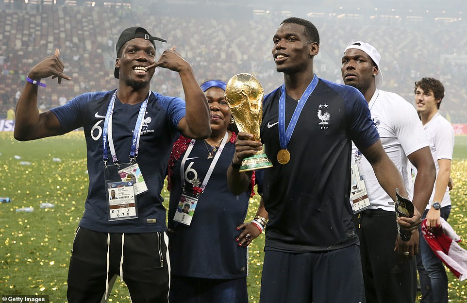 61802591-11154761-Pogba_celebrated_winning_the_World_Cup_with_his_brothers_and_mum-a-3_1661719083613.jpg