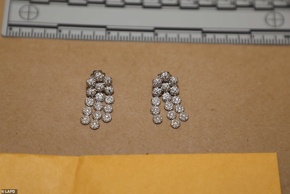 61736343-11146251-Glittering_earrings_were_amongst_the_thousands_of_pieces_of_jewe-a-11_1661946197255.jpg