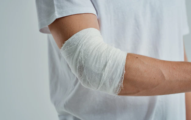 Premium Photo | Man with bandaged arm elbow and finger injury medicine